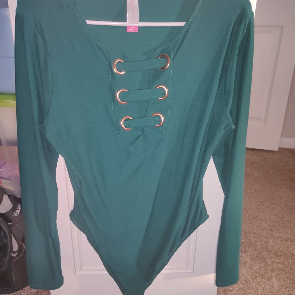 Turquoise body suit.